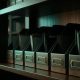 Row of unmarked filing organizers on a dark wooden CPA firm shelf