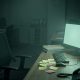 Empty IT support desk in a small CPA firm at night with monitors still glowing