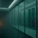 Enterprise security operations corridor at twilight, server racks behind glass, single warm amber indicator in foreground